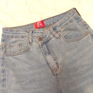 High waisted side button, straight leg. Jean